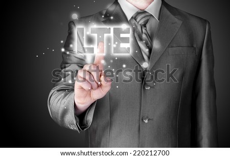 businessman is pushing his finger on lte button