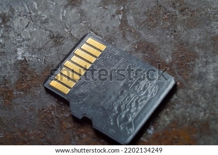 micro sd card lies on a dark background. close-up