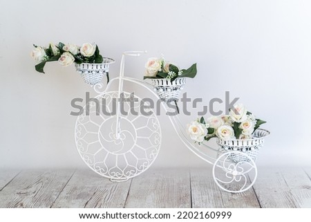 white vintage bicycle with flowers