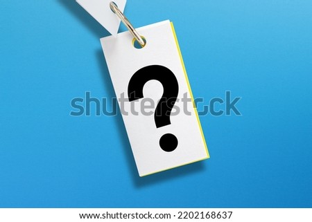 Note paper with question mark on blue background