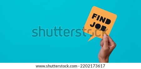 a man is holding a yellow paper speech bubble with the text find job in it, on a blue background, in a panoramic format to use as web banner