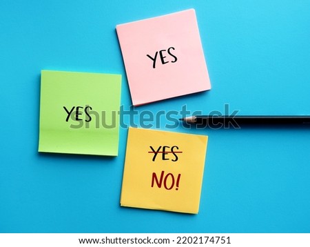 Note paper with handwriting YES YES YES and last one changed to NO, concept of people pleaser try not to feel guilty about saying no, no need to agree or say yes to everything Royalty-Free Stock Photo #2202174751