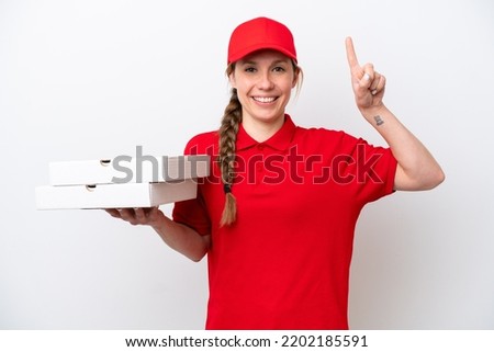pizza delivery woman with work uniform picking up pizza boxes isolated on white background pointing up a great idea