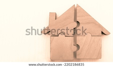 pieces of blue wooden house puzzle isolated on white  background. wooden home made from natural material of jigsaw. puzzle in the form of wood house. for sale or rent. concept of mortgage