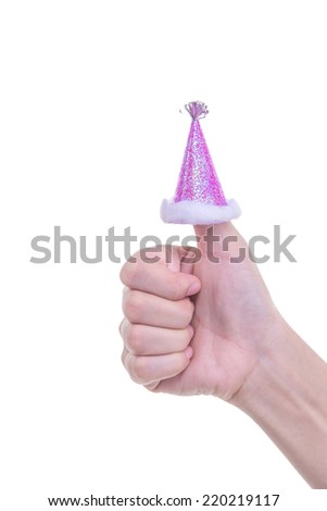 Hand wearing a party cap