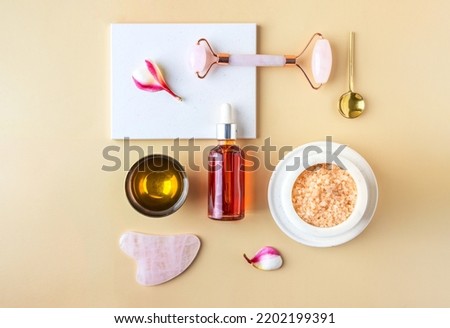 Ayurveda wellness centre  and natura care concept. Top view of  gua sha , natural oil bowl for face and body, sea salt scrab .Flat lay still life