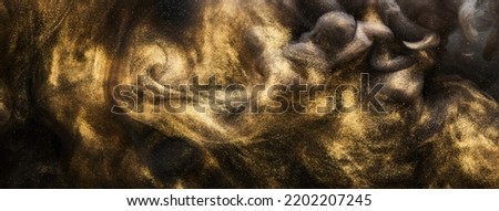 Golden sparkling abstract background, luxury black smoke, acrylic paint underwater explosion, cosmic swirling ink Royalty-Free Stock Photo #2202207245