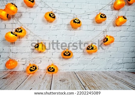 Pumpkin Lights LED for Halloween Decorations on white brick wall background