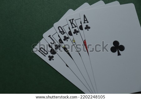 poker royal flush on a dark green background