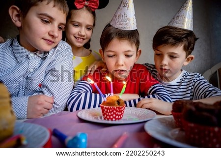 Children on birthday party.children celebrate birthday.small children celebrate birthday at home.celebration concept.