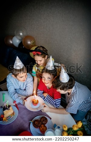 Children on birthday party.children celebrate birthday.small children celebrate birthday at home.celebration concept.
