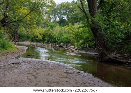Present day Plum Creek near Walnut Grove, MN where Laura Ingalls childhood dugout home was located. Royalty-Free Stock Photo #2202269567