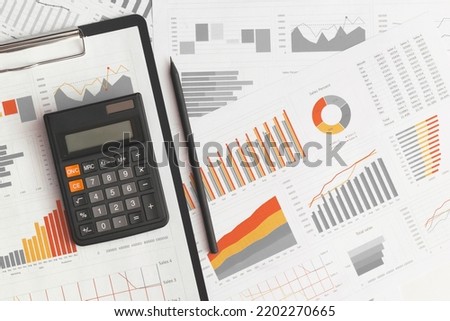 Business graphs, charts and calculator on table. Financial development, Banking Account, Statistics Royalty-Free Stock Photo #2202270665
