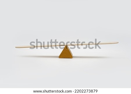 Empty seesaw unbalance on white background.
 Royalty-Free Stock Photo #2202273879