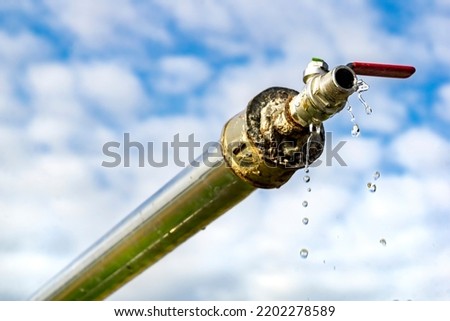 Clear Water Artesian Well, african hold-ups with water water from the spring Royalty-Free Stock Photo #2202278589