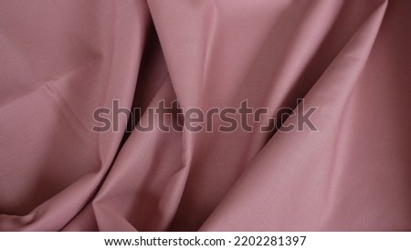 Beautiful dusty pink color fabric texture seamless with beautiful closeup detail fabric. Unique cotton fabric pattern texture for crafting and sewing projects.