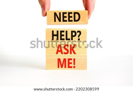 Support and need help ask me symbol. Concept words Need help ask me on wooden blocks on a beautiful white table white background. Businessman hand. Business, support and Need help ask me concept.
