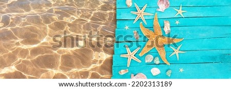 Starfish, shells on wooden blue boards of pier with clear water of sea with sand. Vacation, travel, beach. Banner. Copy space