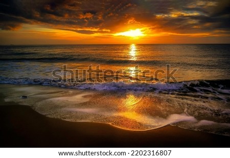 Sunset over the sea beach. Sunset beach landscape. Sea horizon at sunset. Sunset sandy beach landscape Royalty-Free Stock Photo #2202316807