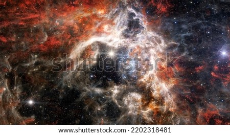Tarantula Nebula, 30 Doradus, NGC 2070, Star-forming region in the deep space. Gas accumulation in outer space. James webb telescope. Space landscape. JWST. Elements of this image furnished by NASA. Royalty-Free Stock Photo #2202318481