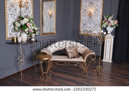 Living room with beautiful interior, sofa and flowers. Vintage-style room