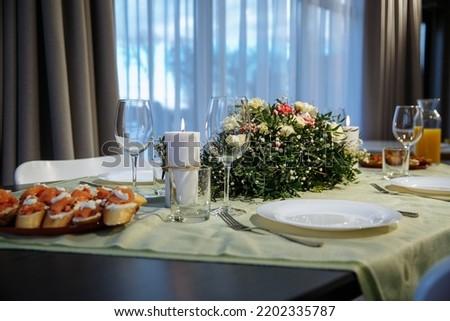 glasses on the table with dishes