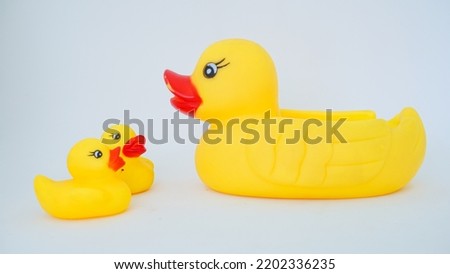 Yellow rubber ducks isolated on a white background. Big rubber duck and small rubber ducks. baby and mother duck