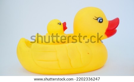 Yellow rubber ducks isolated on a white background. Big rubber duck and small rubber ducks. baby and mother duck