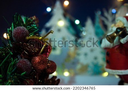 picture Christmas decoration with baubles - gift houses illuminated by atmospheric bokeh