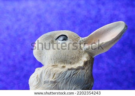 Abstract figurine of a rabbit. Symbol of 2023 according to the Eastern calendar. Background with copy space for text