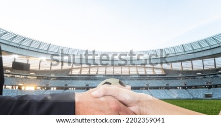 Composition of businessman and businesswoman shaking hands over sports stadium. sport and competition, business and finance concept digitally generated image.