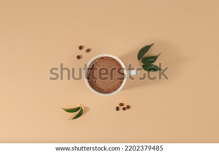 Coffee drink with milk, chocolate and whipped cream, cappuccino coffee, latte, cinnamon, coffee beans on a light table, modern coffee shop advertisement, minimal creative composition, selective focus,