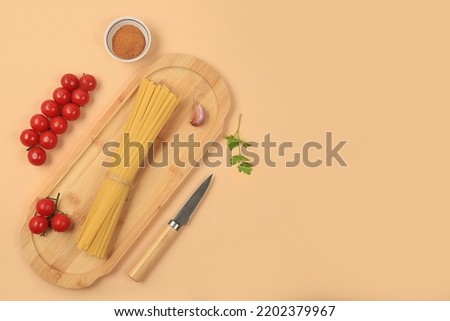 Kitchen background with ingredients for spaghetti cooking recipe, minimal cooking concept, traditional italian cuisine, business card for restaurant, cafe, shop, menu, selective focus, 