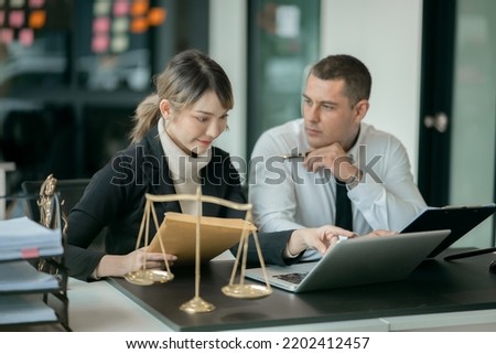 Lawyers sit for a meeting with the team at the law firm.