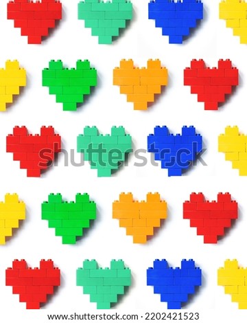 Colors Hearts from Legoblocks as background, minimal geometric pattern from plastic blocks, shapes heart from child construction. Top view repeat colorful pattern, Toys, games and recreation