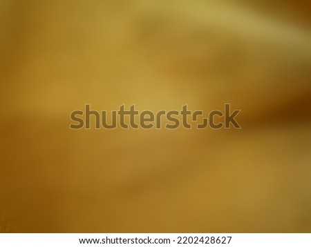 Defocused or blurred abstract background of a pale yellow that symbolizes wealth and prosperous