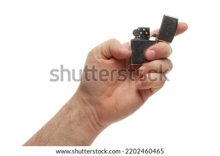 Hand hold holding lighter, isolated on white background with clipping path Royalty-Free Stock Photo #2202460465
