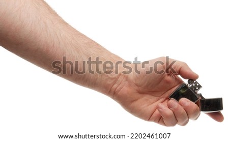 Hand hold holding lighter, isolated on white background with clipping path Royalty-Free Stock Photo #2202461007