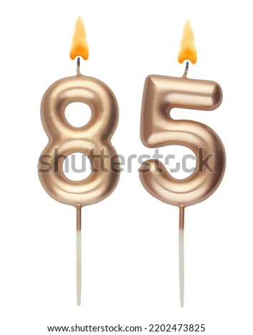 Gold birthday candles isolated on white background, number 85 Royalty-Free Stock Photo #2202473825
