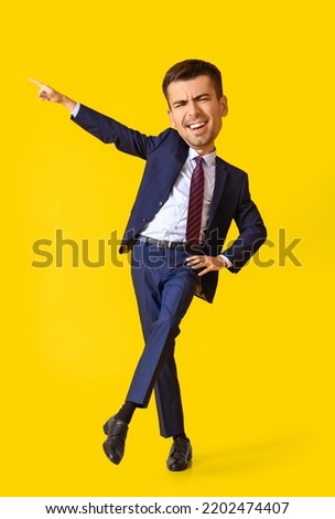 Happy dancing businessman with big head on yellow background