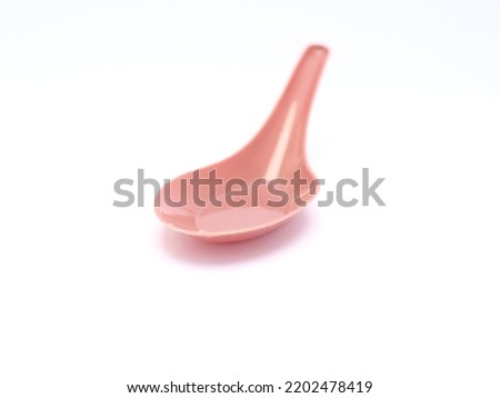 A spoon is made of plastic being molded