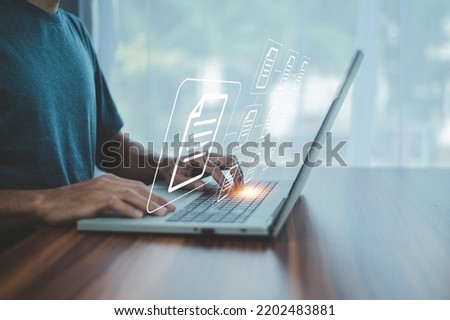 Businessman using computer Document Management System (DMS), online documentation database process automation to efficiently manage files