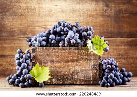 grape in wooden box on wooden background