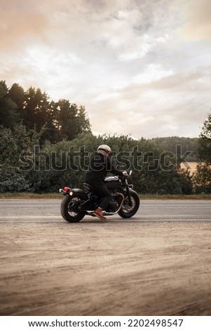 Photo of a motorcyclist on the road. Photo of a motorcyclist on the road. Lifestyle wallpaper. Voyage