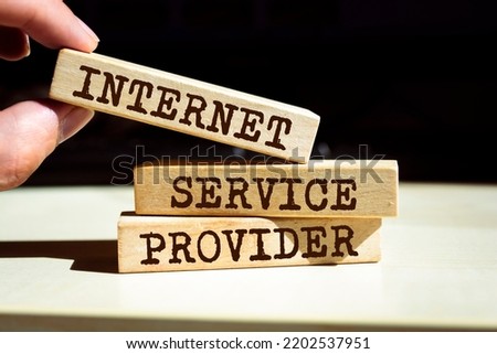 Wooden blocks with words 'Internet Service Provider'. Business concept