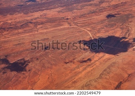 Aerial shots over the Australian outback and its red structures of the continent

