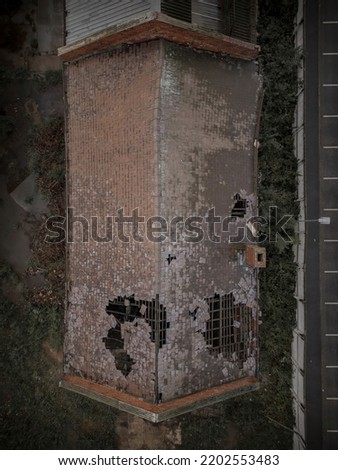 Old generic derelict industrial buildings in a dilapidated state aerial view Royalty-Free Stock Photo #2202553483