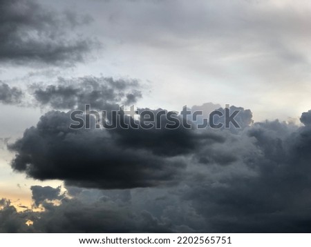 Blur and Dusk overcast sky before to rainy in evening time. Dusk overcast sky in rainy season. Rainy cloudy floating on the sky. Royalty-Free Stock Photo #2202565751