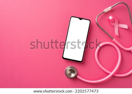 Top view photo of stethoscope pink ribbon symbol of breast cancer awareness and smartphone on isolated pink background with empty space