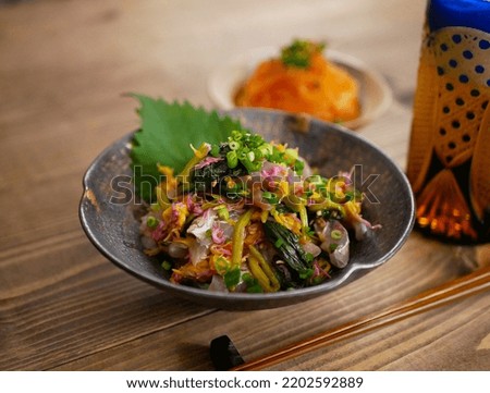 Horse mackerel sashimi with chrysanthemum flowers